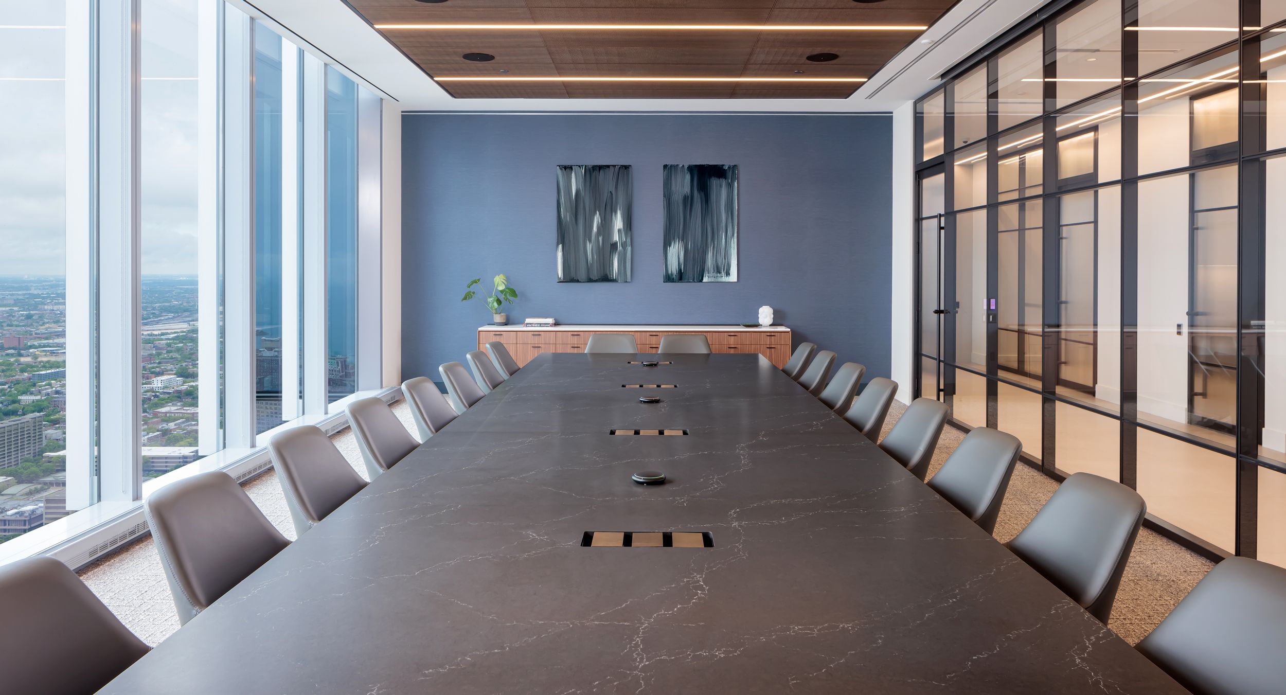 The centerpiece to this luxurious conference space is an 84x321 SESSIONS table. A HALO credenza in quarter-cut walnut is the perfect complement.